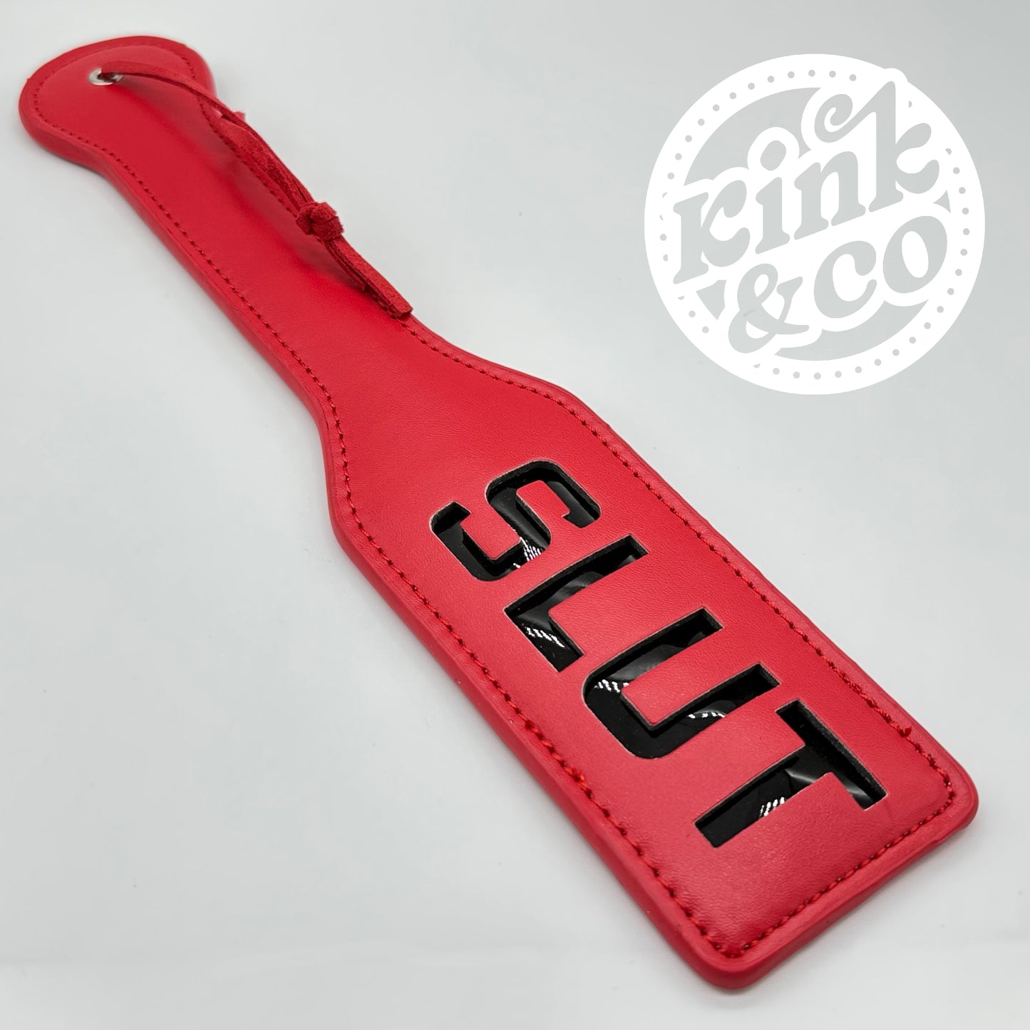 Slut-Slapper-Paddel aus Leder – von Kink&Co