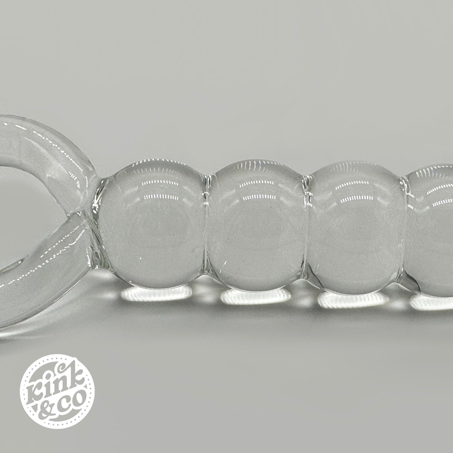 Side of Glass anal beads with O ring Handle - By Kink&Co