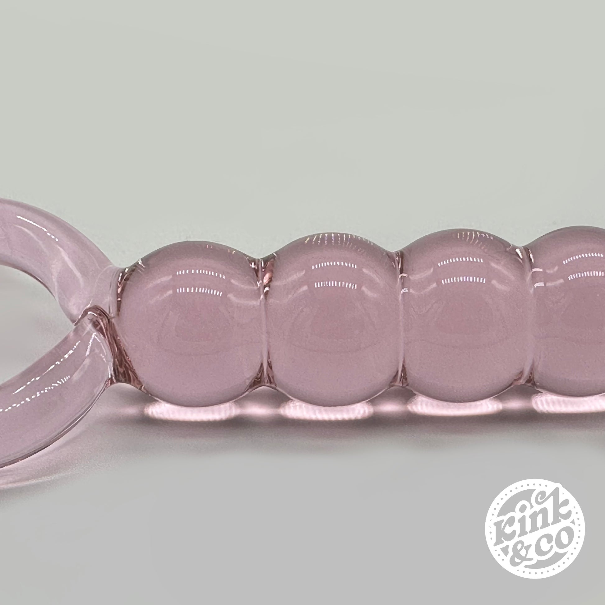 Beads of pink Glass anal beads with O ring Handle - By Kink&Co