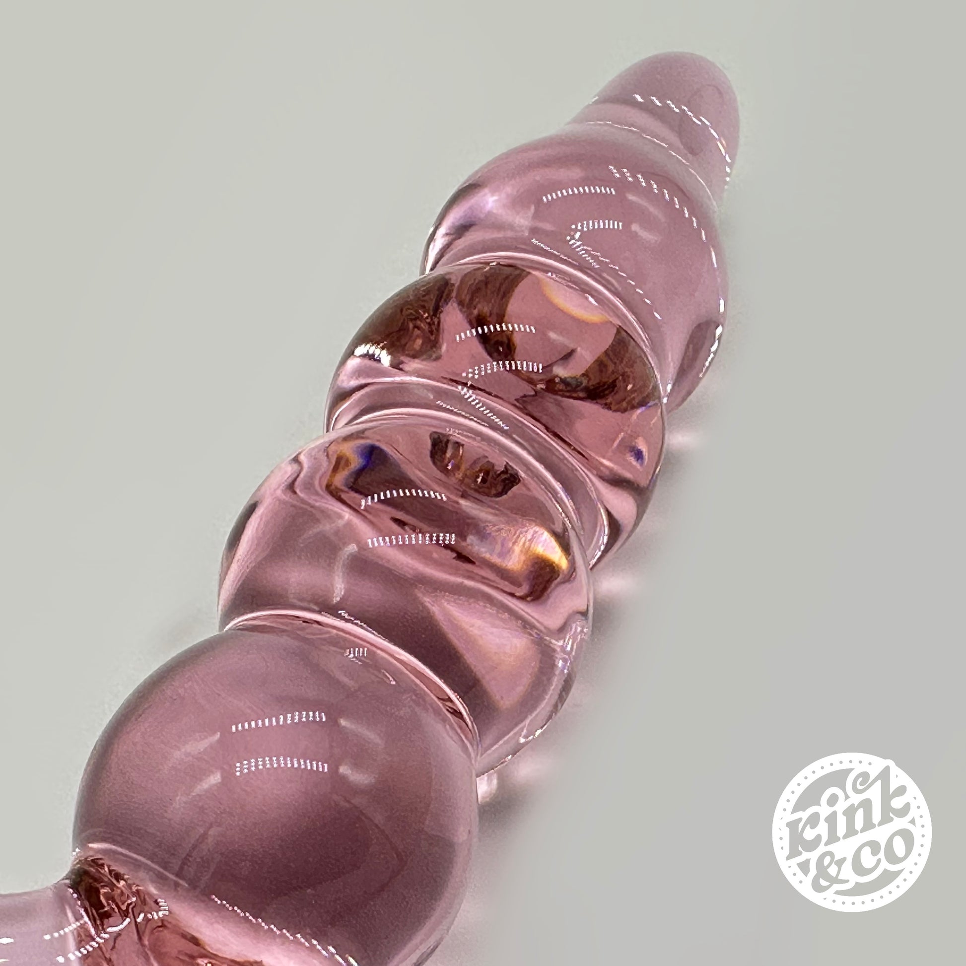 Beads of pink Glass anal beads with O ring Handle - By Kink&Co